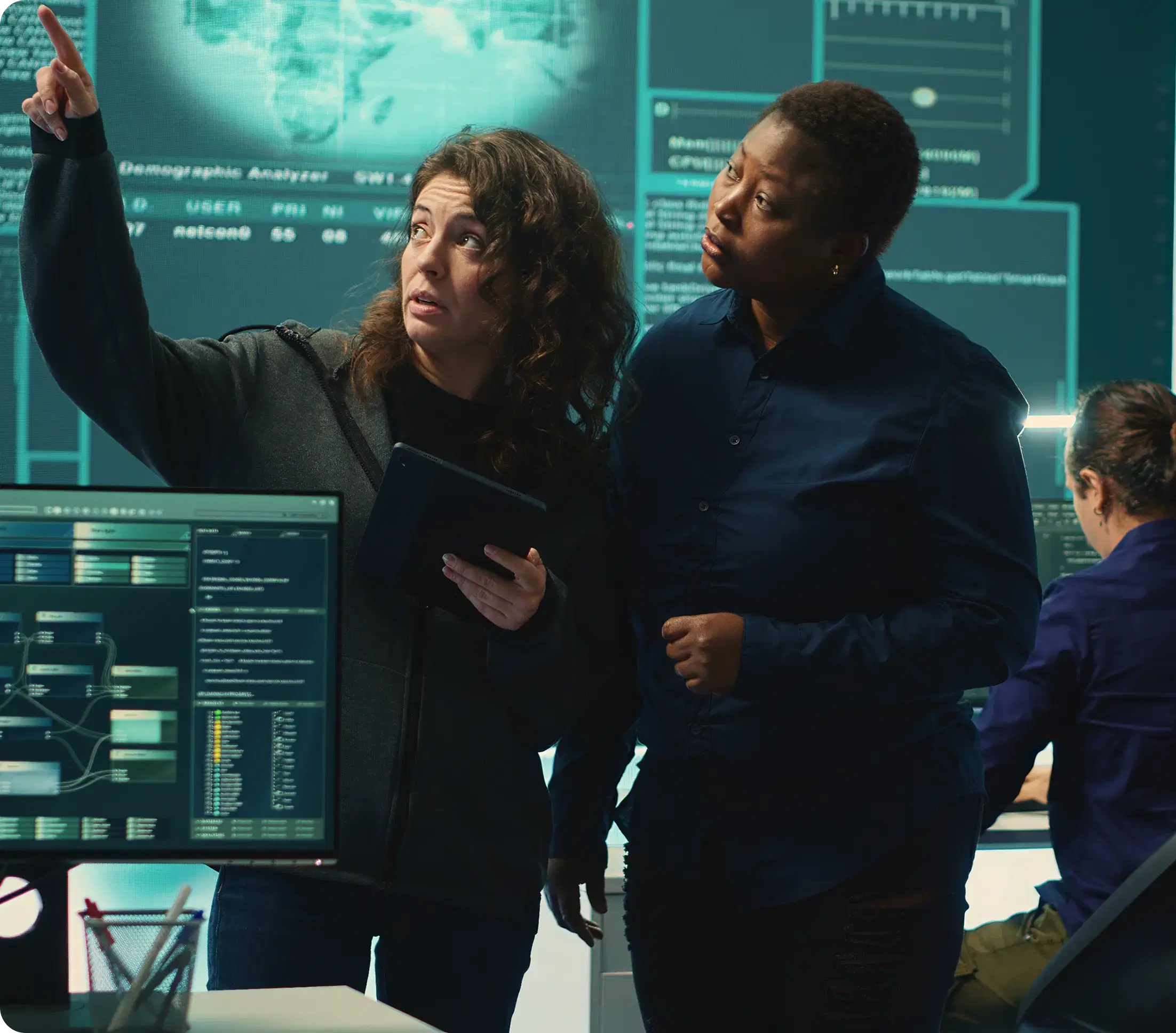 Cybersecurity team analyzing threats on digital screens